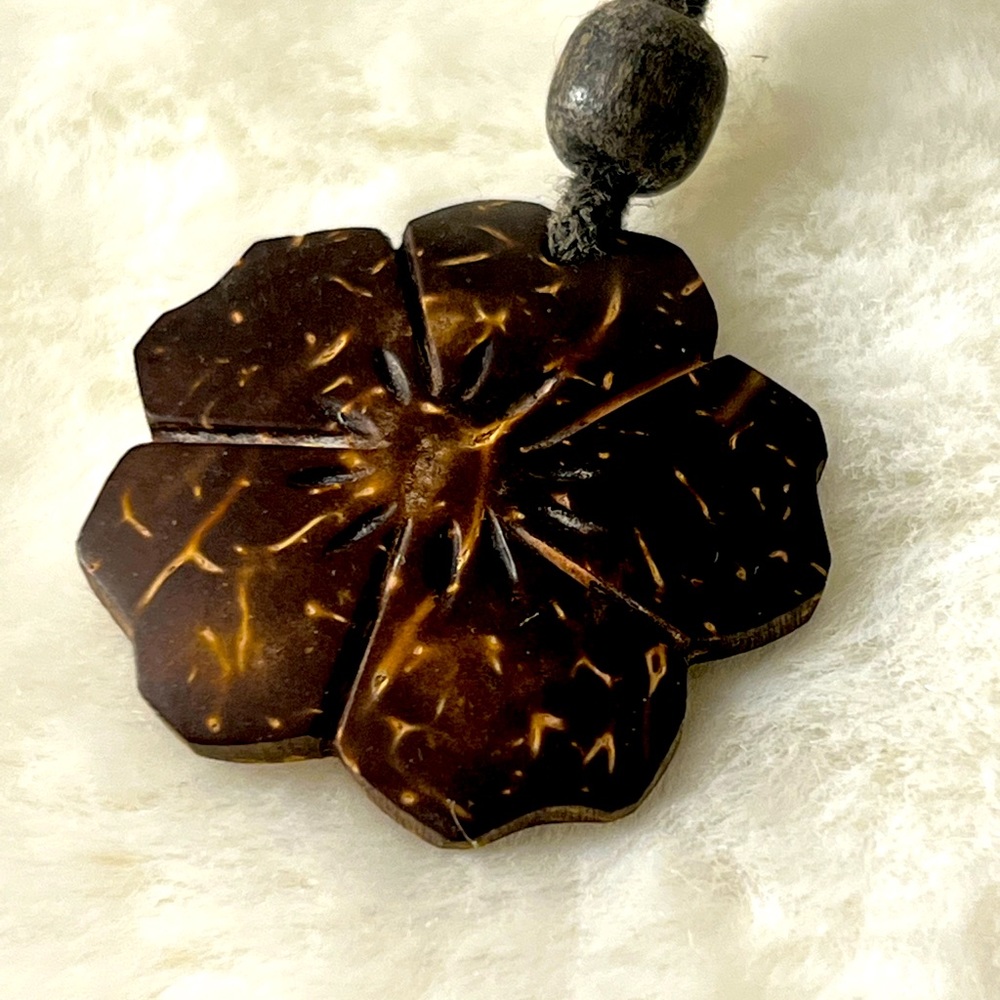 Coconut shell craved plumeria pendant